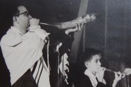 My father blowing a shofar next to a young me also blowing