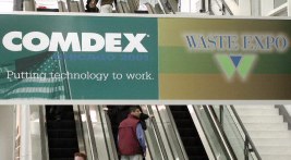 Escalator with Comdex and Waste Expo signs