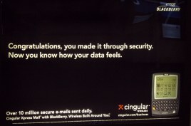 Sign: Congratulations, you have made it through security. Now you know how your data feels. (With a picture of a Blackberry)